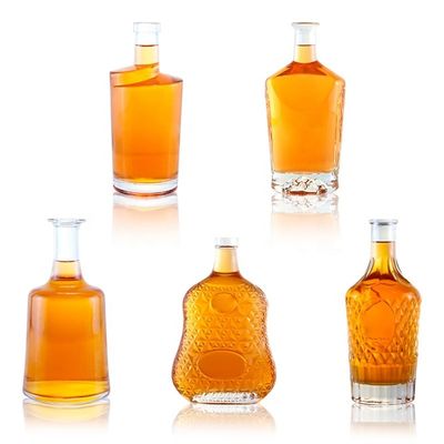 2023 Botellas de vidrio transparentes Botellas de bebida de vidrio con material base congelado Logotipo personalizado