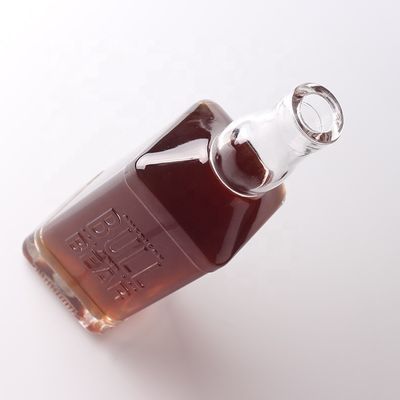 Material del cuello Vidrio 500 ml 700 ml Botella transparente en relieve para whisky ron ginebra brandy