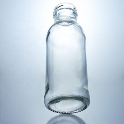 Botella de bebida de vidrio transparente Popular 100ml260ml 500ml 1000ml Botella redonda con tapa de tornillo