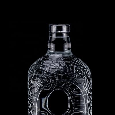 Vidrio redondo tallado 700ml 750ml Vodka Botella de vidrio Botella de vino con tipo de sellado de corcho