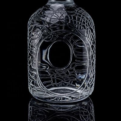 Vidrio redondo tallado 700ml 750ml Vodka Botella de vidrio Botella de vino con tipo de sellado de corcho