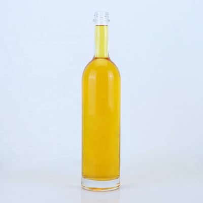 Logotipo personalizado 700ml 750ml botella de vidrio de forma redonda de piedra alta con acabado superior de tornillo