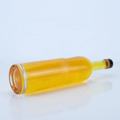 Logotipo personalizado 700ml 750ml botella de vidrio de forma redonda de piedra alta con acabado superior de tornillo
