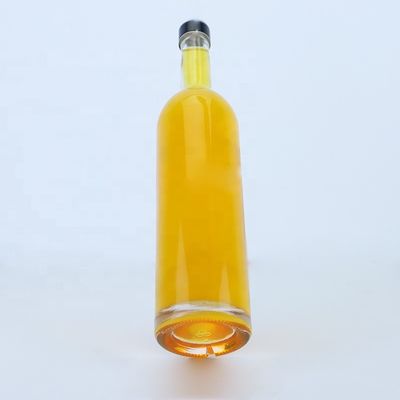 Logotipo personalizado 700ml 750ml botella de vidrio de forma redonda de piedra alta con acabado superior de tornillo