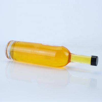 Logotipo personalizado 700ml 750ml botella de vidrio de forma redonda de piedra alta con acabado superior de tornillo