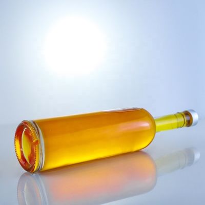 Logotipo personalizado 700ml 750ml botella de vidrio de forma redonda de piedra alta con acabado superior de tornillo