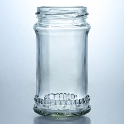 Diseño único 100ml 300ml 500ml Jarrón de vidrio de miel de campo con tapa Productos de vidrio transparente