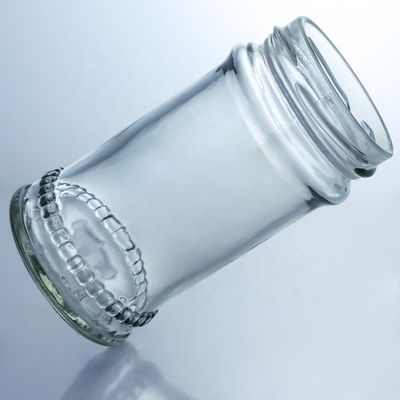 Diseño único 100ml 300ml 500ml Jarrón de vidrio de miel de campo con tapa Productos de vidrio transparente