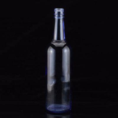 Botella de licor de vidrio de 750 ml con material de cuello dorado y diseño final para vodka