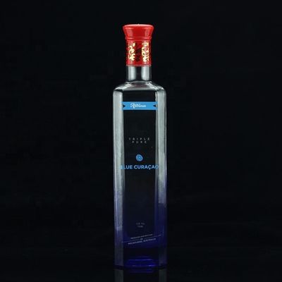 Botella de licor de vidrio de 750 ml con material de cuello dorado y diseño final para vodka