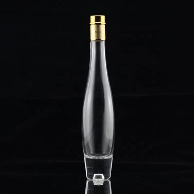 Botella de alcohol de vidrio transparente de 750 ml a granel con tapa metálica dorada