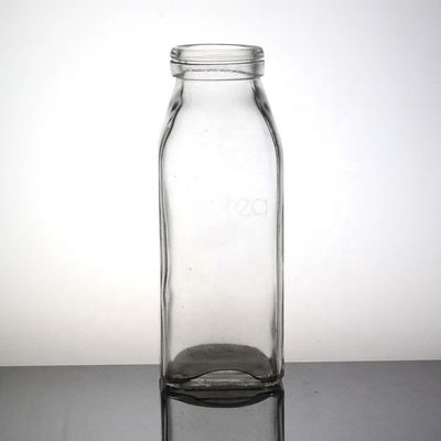 Botella de jugo de manzana transparente en forma de 500 ml Botella de vidrio de sílex alto con tapa de plástico