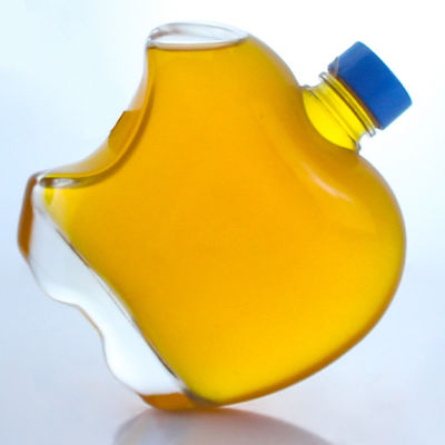 Botella de vidrio en forma de manzana con tapa personalizada para vodka y tequila whisky en vidrio de piedra