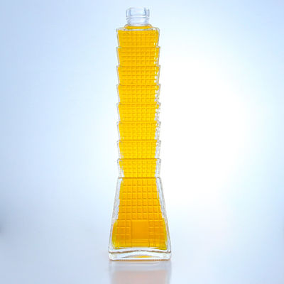 Botella de vidrio en forma de torre para vodka brandy tequila logotipo personalizado