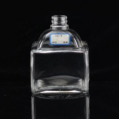 Botella de vidrio industrial de 700 ml para la industria de bebidas en forma de pulgar