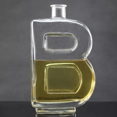 Material base Botella de vidrio con forma de letra única y tapa de corcho