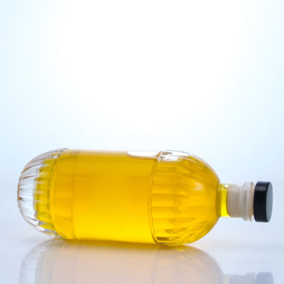 Botella de vidrio para bebidas industriales con diseño en relieve y forma redonda de corcho