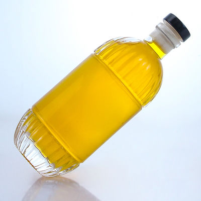 Botella de vidrio para bebidas industriales con diseño en relieve y forma redonda de corcho
