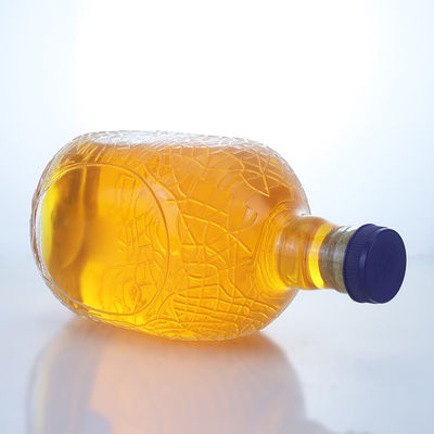 Forma redonda única en relieve de calidad alimentaria ron vodka whisky tequila ginebra botella de vidrio con corcho perfecto