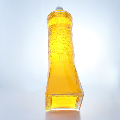 Botella de vidrio de licor industrial con forma única y material de súper sílex en relieve
