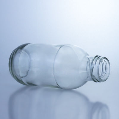 Botella de leche de vidrio redonda de 300 ml con tapa Solución de almacenamiento de licor Manipulación de la superficie decal