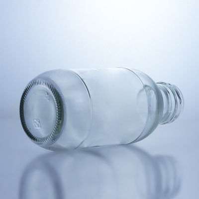 Botella de leche de vidrio redonda de 300 ml con tapa Solución de almacenamiento de licor Manipulación de la superficie decal