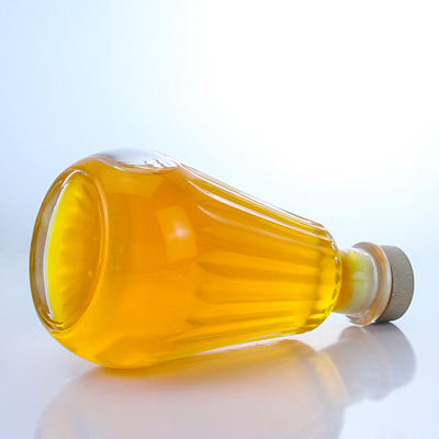 Botella redonda de vidrio con tapa de corcho y logotipo personalizado para ron vodka whisky tequila gin