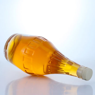 Botella de vidrio de sílex de diseño elegante de 700 ml para champán de forma única y vacía