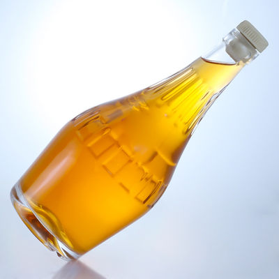Botella de vidrio de sílex de diseño elegante de 700 ml para champán de forma única y vacía