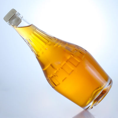Botella de vidrio de sílex de diseño elegante de 700 ml para champán de forma única y vacía