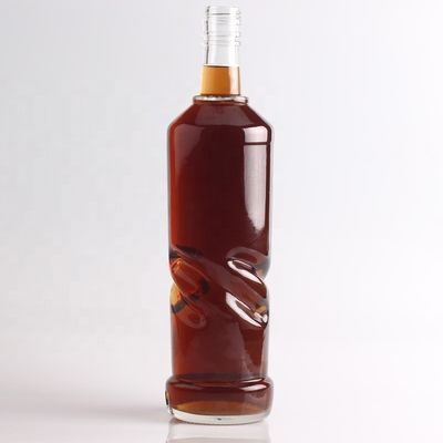2022 Botella de vidrio de fondo grueso en relieve de piedra clara para ginebra whisky ron tequila brandy