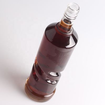 2022 Botella de vidrio de fondo grueso en relieve de piedra clara para ginebra whisky ron tequila brandy
