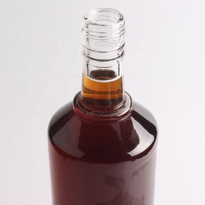 2022 Botella de vidrio de fondo grueso en relieve de piedra clara para ginebra whisky ron tequila brandy