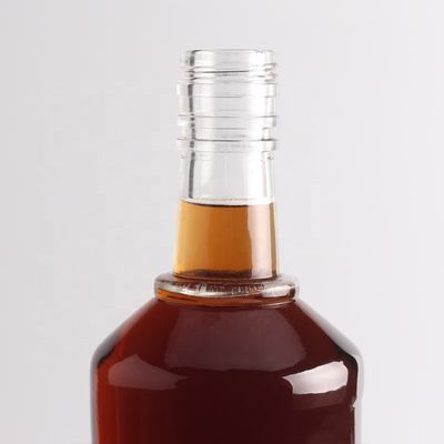 2022 Botella de vidrio de fondo grueso en relieve de piedra clara para ginebra whisky ron tequila brandy