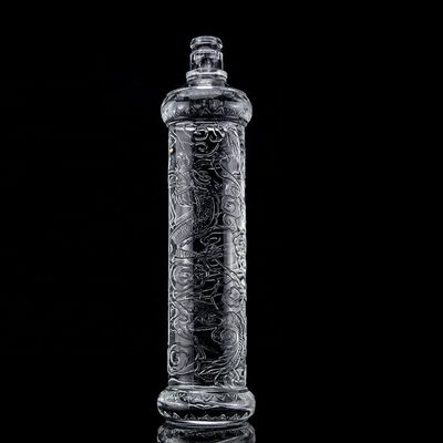 Hermosa botella de vidrio en relieve de dragón con tapa dorada logotipo personalizado y base de vidrio